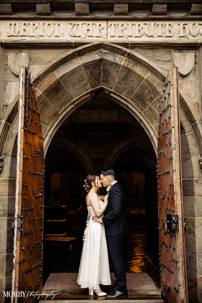 Merion Tribute House - Where your story begins bride and groom first kiss